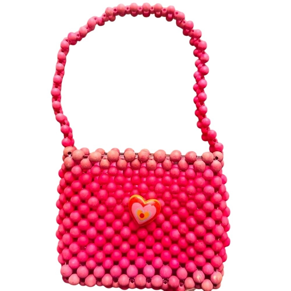 Pink and red beaded‎ bag with heart charm